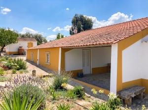 a row of cottages in a garden at Kochab Alentejo in Crato