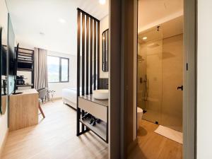 a bathroom with a sink and a toilet and a shower at Blues Suites Laureles in Medellín