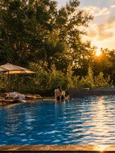 a woman and a child in a swimming pool at Lula Apartments in Ulcinj