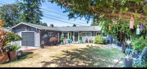 a house with a yard in front of it at Cozy Private Studio in Des Moines