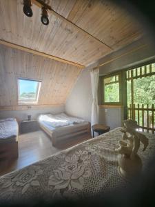 a bedroom with a bed with a teddy bear on it at KAPITAŃSKA 88 - 3 min pieszo do plaży in Chłopy