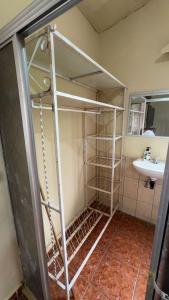 a bunk bed in a bathroom with a sink at Accommodation #6 in Copán Ruinas in Copán Ruinas