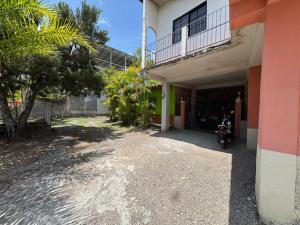 a motorcycle parked in front of a building at Accommodation #6 in Copán Ruinas in Copán Ruinas