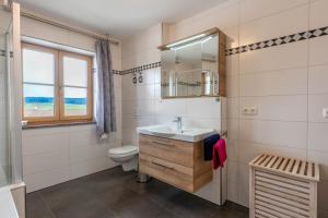 a bathroom with a sink and a toilet at Kramerhof - Ferienwohnung Zugspitze in Aufhofen +15 photos