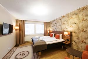 Postel nebo postele na pokoji v ubytování SPiS Hotell Naran