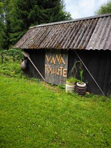 a black shed with a sign that says xena future at Sauna Suite 2 in Valga +4 photos