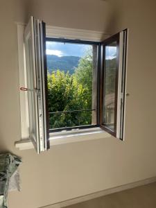 a window in a room with a view at San Leo Apartment in Stia