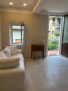 a living room with a couch and a table at San Leo Apartment in Stia