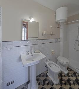 a bathroom with a sink and a toilet at Terrediliguria - Lerici in Lerici +7 photos