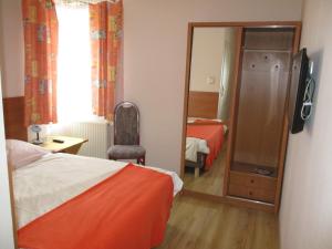 Łóżko lub łóżka w pokoju w obiekcie Hotel Pod Platanami
