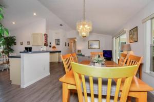 a dining room and kitchen with a table and chairs at Villa Mourik in Inverness