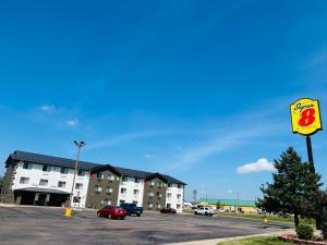 a hotel with a sign in a parking lot at Super 8 by Wyndham Sioux City South in Sioux City