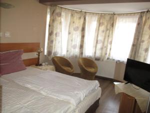 Łóżko lub łóżka w pokoju w obiekcie Hotel Pod Platanami