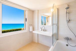 a bathroom with a shower and a sink and a window at Villa Myla in Kato Yialia +19 photos