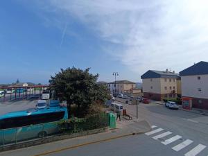 a view of a street with a parking lot at Apartamentos Illa Pancha in Ribadeo