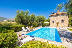 an image of a villa with a swimming pool at Villa Demetra in Áyios Dhimítrios