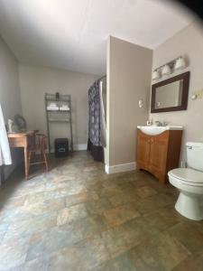 a bathroom with a toilet and a sink at The old parsonage bed and breakfast in Kennebunkport