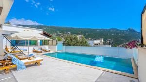 a villa with a swimming pool with a view at Secluded Sea-View Family Escape-Villa Bella2 Sardunya in Üzümlü