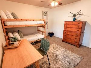 a room with a bunk bed and a table and a desk at Lake and Mountains, 3BR 2BA in Show Low