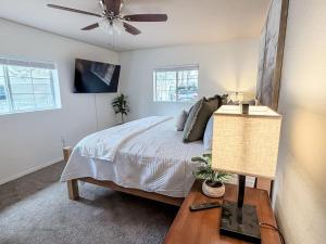 a bedroom with a bed and a ceiling fan at Lake and Mountains, 3BR 2BA in Show Low