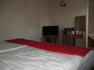 Łóżko lub łóżka w pokoju w obiekcie Hotel Pod Platanami