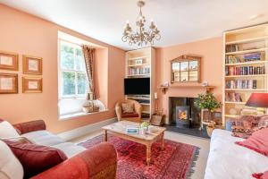 a living room with a couch and a fireplace at 3 Bed in Castlemorris oc-94522 in Castlemartin