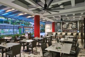 a restaurant with tables and chairs and a ceiling at Singapore Marriott Tang Plaza Hotel in Singapore