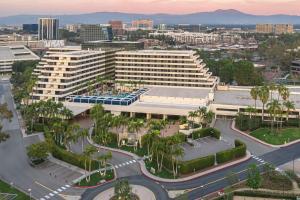 an aerial view of a city with a large building at Renaissance Newport Beach Hotel in Newport Beach