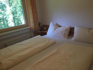 Cama ou camas em um quarto em Waldhaus