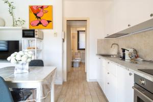 a kitchen with a sink and a counter top at Pepita del Lago - Piscina e Parcheggio privato in Lenno