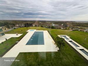 an overhead view of a swimming pool in a park at Azahar Hotel & Spa in San Pedro