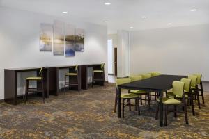 a conference room with a black table and chairs at Residence Inn by Marriott Palo Alto Menlo Park in Menlo Park