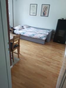 a room with a bed and a table and a dining room at Drinika in Foča