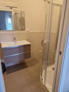 a bathroom with a sink and a shower at La Casina di Titty in Stia +30 photos
