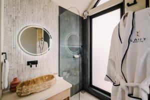 a bathroom with a sink and a mirror at Lakay Monteverde with Heated Pool, Golf Cart and Breakfast in Monteverde Costa Rica +50 photos