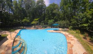 an overhead view of a swimming pool in a yard at Autumn Wings - Propane Grill, Wifi, Kid Friendly, King Bed, Games, Screen Porch, Pool Access, Hiking in Berkeley Springs