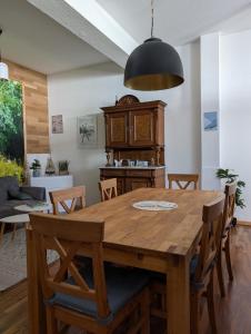 a dining room with a wooden table and chairs at Isny Zentrum Studio Appartement in Isny im Allgäu
