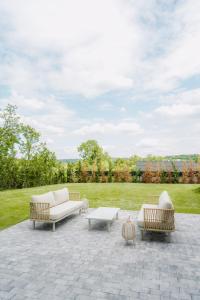 a patio with three couches and a coffee table at Oakville House - Kosmaj - Avala in Mala Ivanča