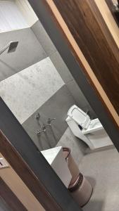 an overhead view of a bathroom with a toilet at Hotel Dhamija divine inn in Sirsa