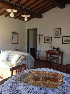 a living room with a couch and a table at Borgo del Molinello in Sant'Albino