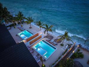 an aerial view of two swimming pools on the beach at Solymar Villa 3 in Jambiani +20 photos