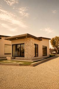 a small house with a stone at Sed de Valle-Valle de Guadalupe in Ensenada