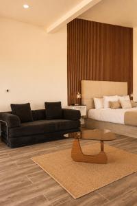 a living room with a couch and a coffee table at Sed de Valle-Valle de Guadalupe in Ensenada