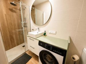 a washing machine in a bathroom with a mirror at Can Costals Cerezo in Pals +35 photos