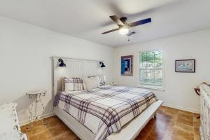 a bedroom with a bed and a ceiling fan at <1 Block to Trails! Conway Biker & Hikers Haven in Conway