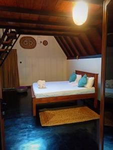 a room with a bed with towels on it at Dambulla Tiger Rock Hotel with Mountain Viewpoint in Dambulla +52 photos