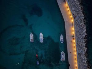 an overhead view of boats in the water at night at Apartment Black Diamond in Ražanac