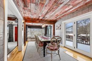 a dining room with a table and chairs at Stowestruck in Stowe +28 photos