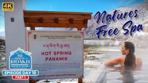 a poster of a woman in a hot spring pamuki at Mystique Meadows Swiss Cottages in Nubra