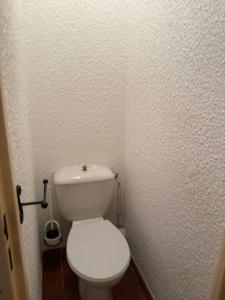 a bathroom with a white toilet in a room at Apparthotel Saint Tropez centre in Saint-Tropez